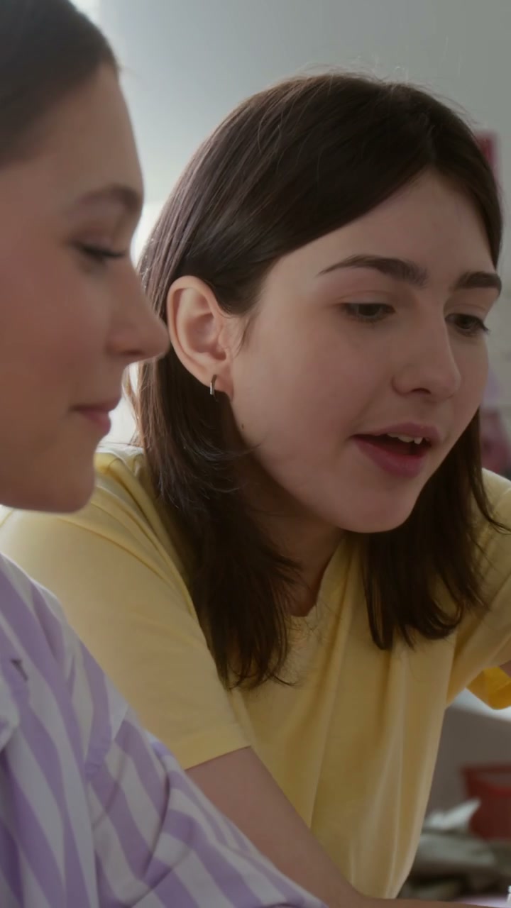 Teenage Friends Chatting Indoors