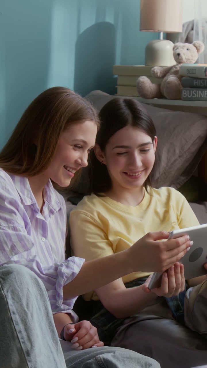 Two Young Women Using Tablet Together