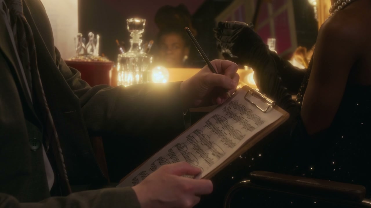 Musician Writing Sheet Music Backstage