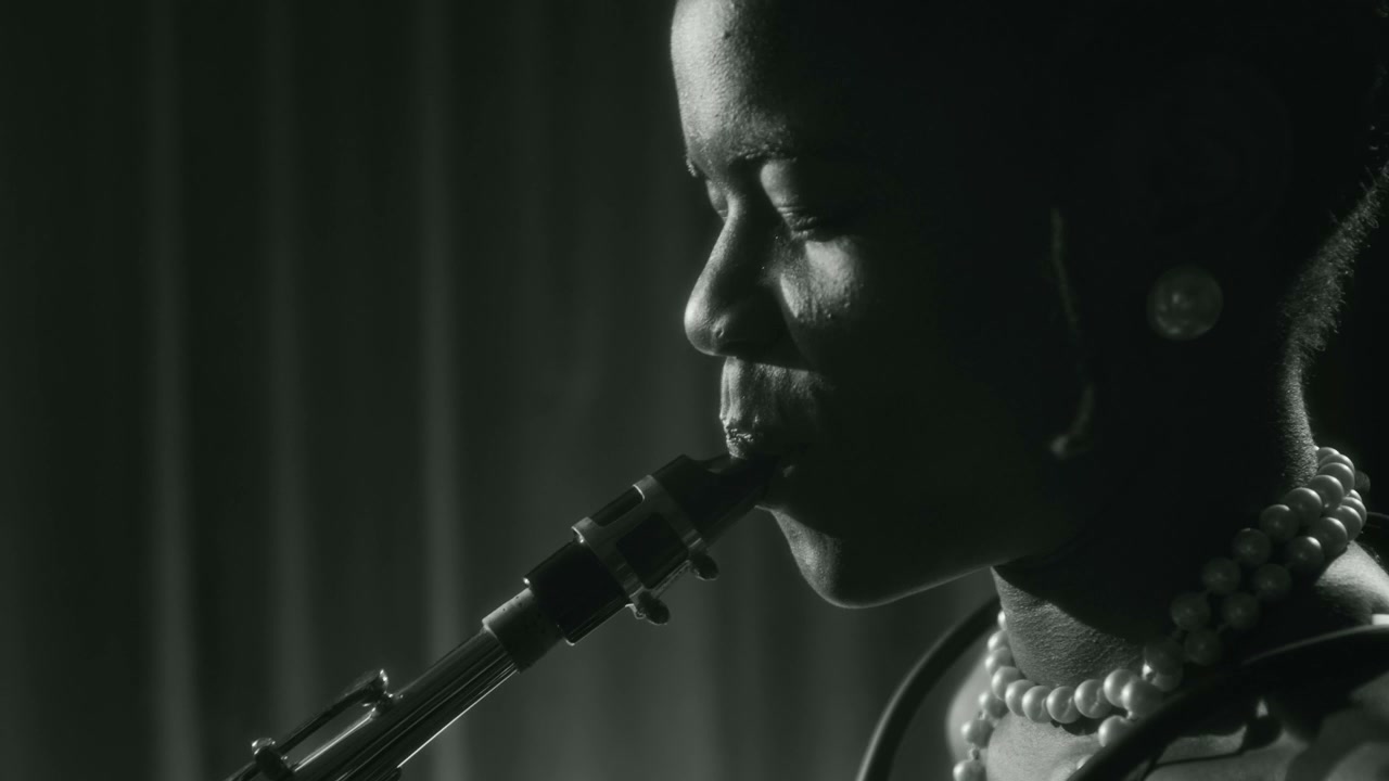 Black Woman Playing Saxophone in Black and White