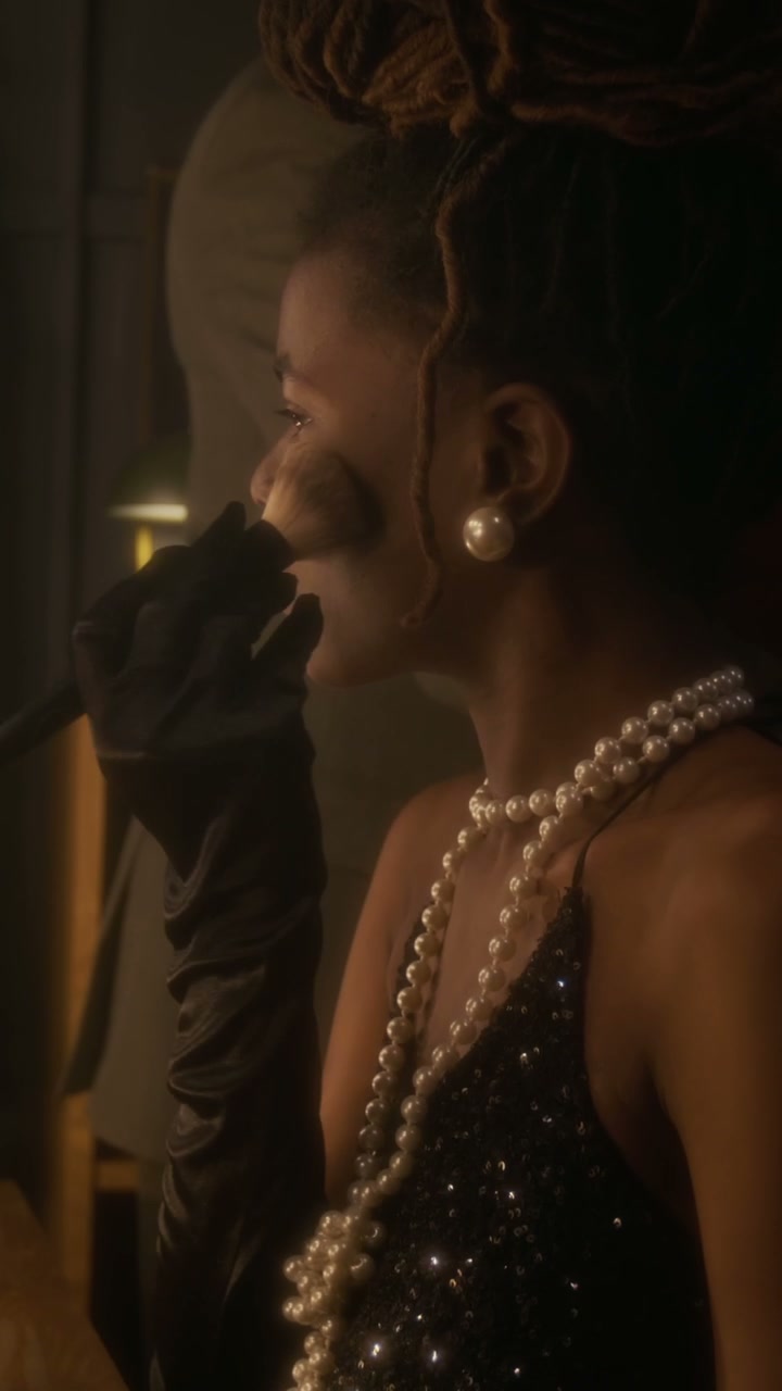 Glamorous Woman Applying Makeup Backstage