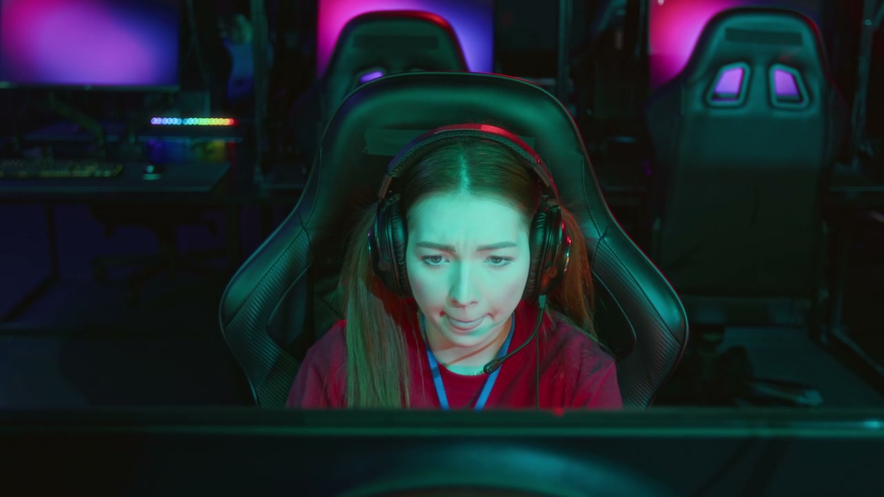 Focused Female Gamer in Dark Esports Arena