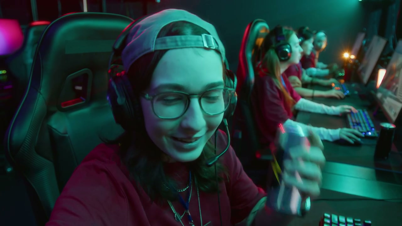 Female Gamer Poses With Energy Drink in Esports Club
