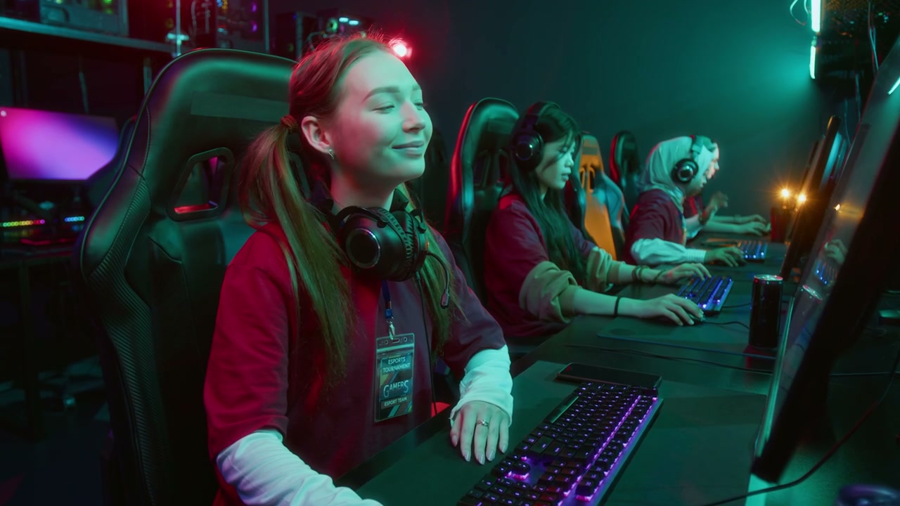 Portrait of Laughing Caucasian Female Gamer Team Member in Cyberclub