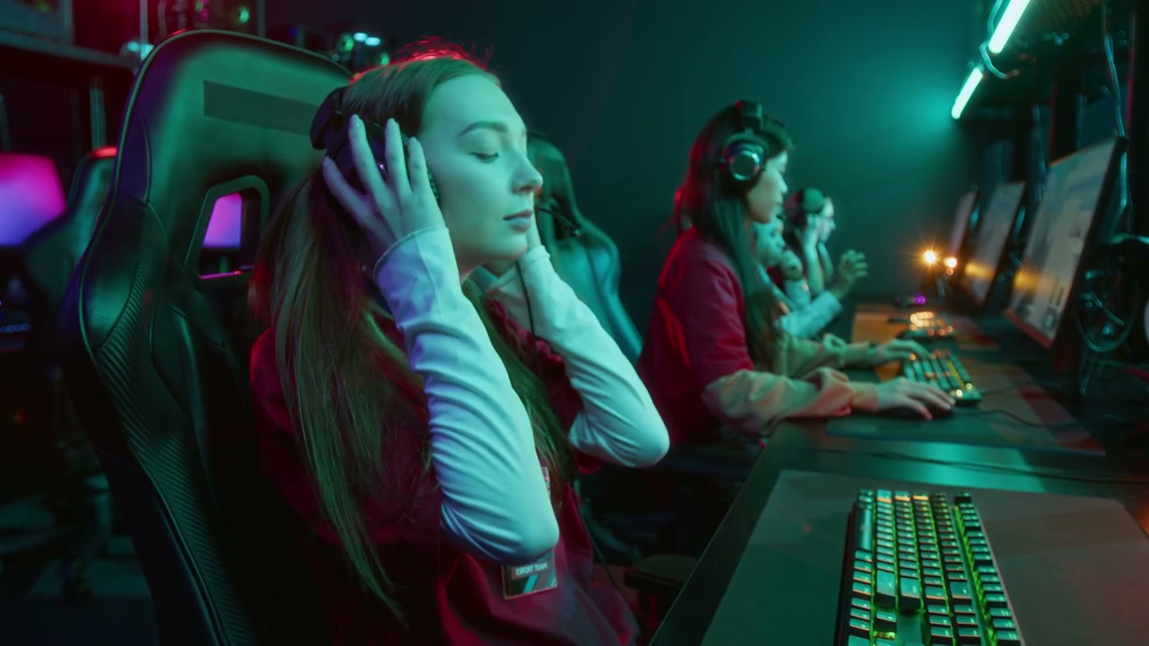 Young Caucasian Woman Putting on Headset in Cyberclub to Play with Diverse Team