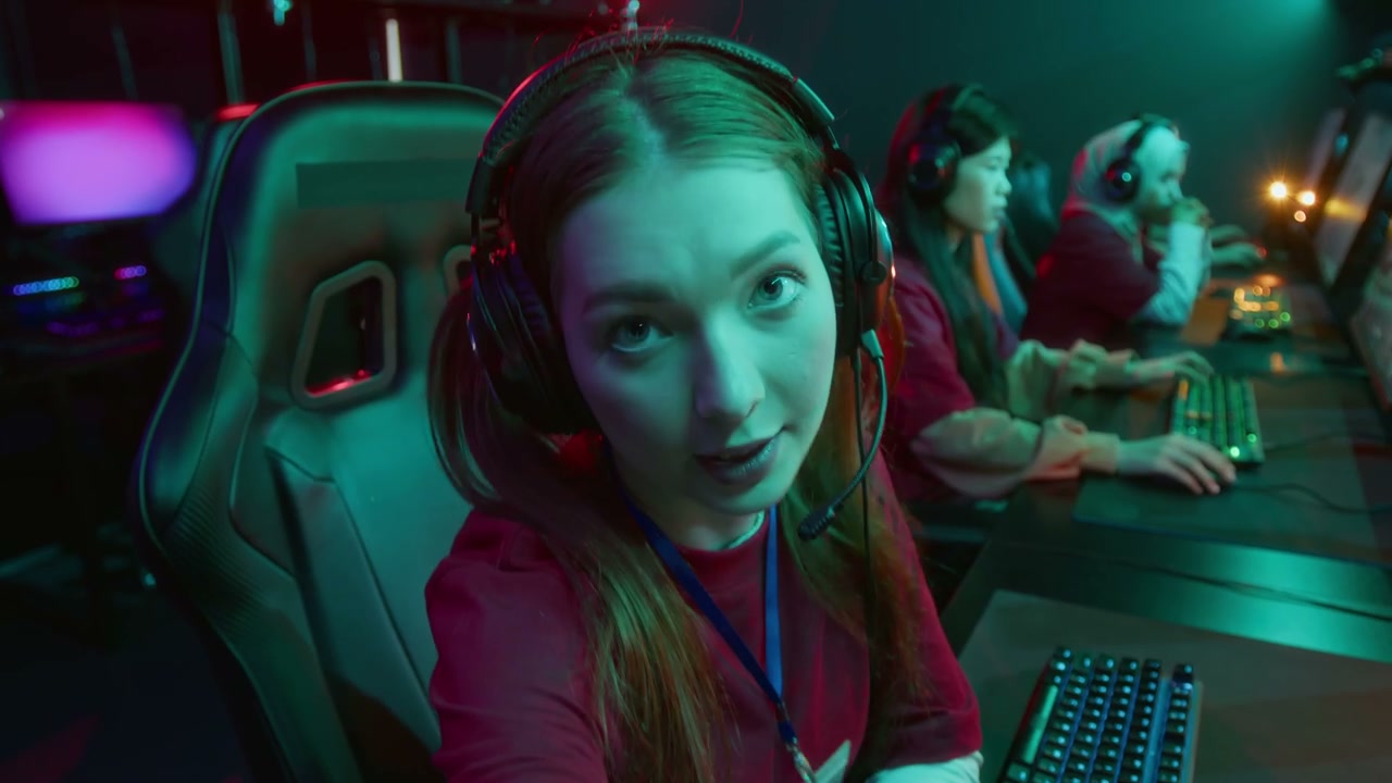 Cheerful Caucasian Gamer Girl Broadcasting from Online Cybersport Event