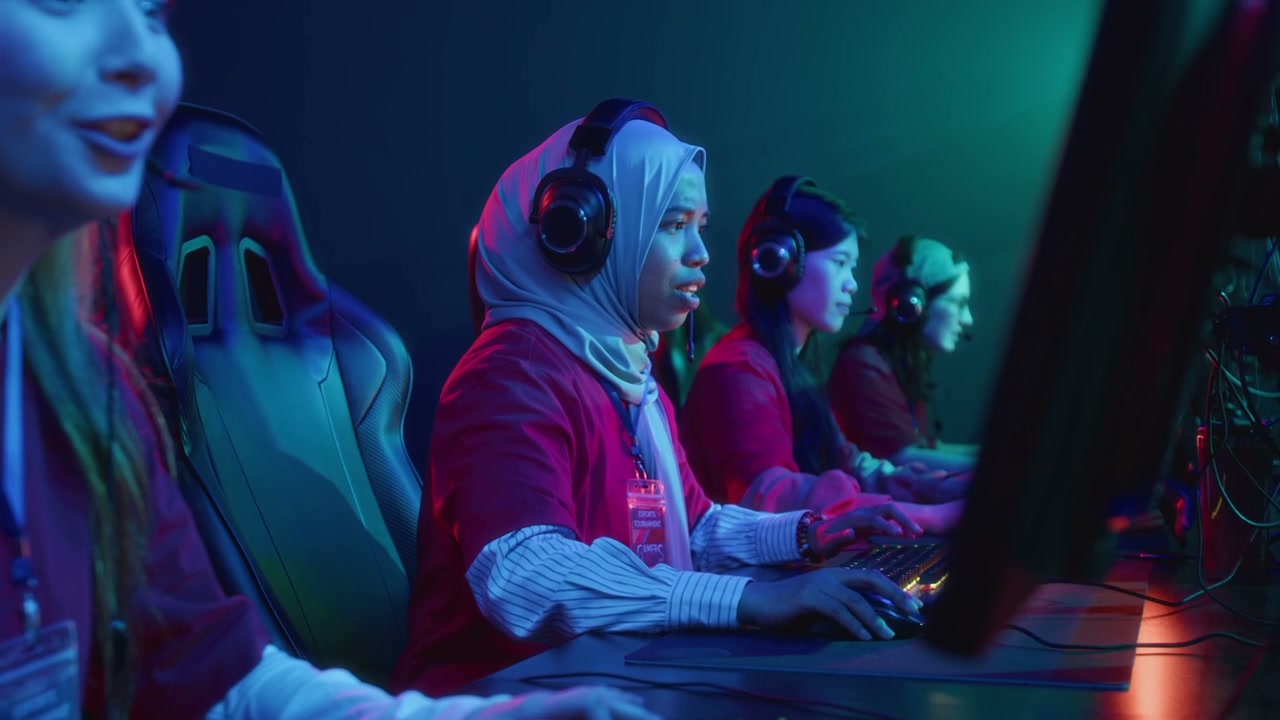 Female Gamers Celebrating Victory in Cyberclub