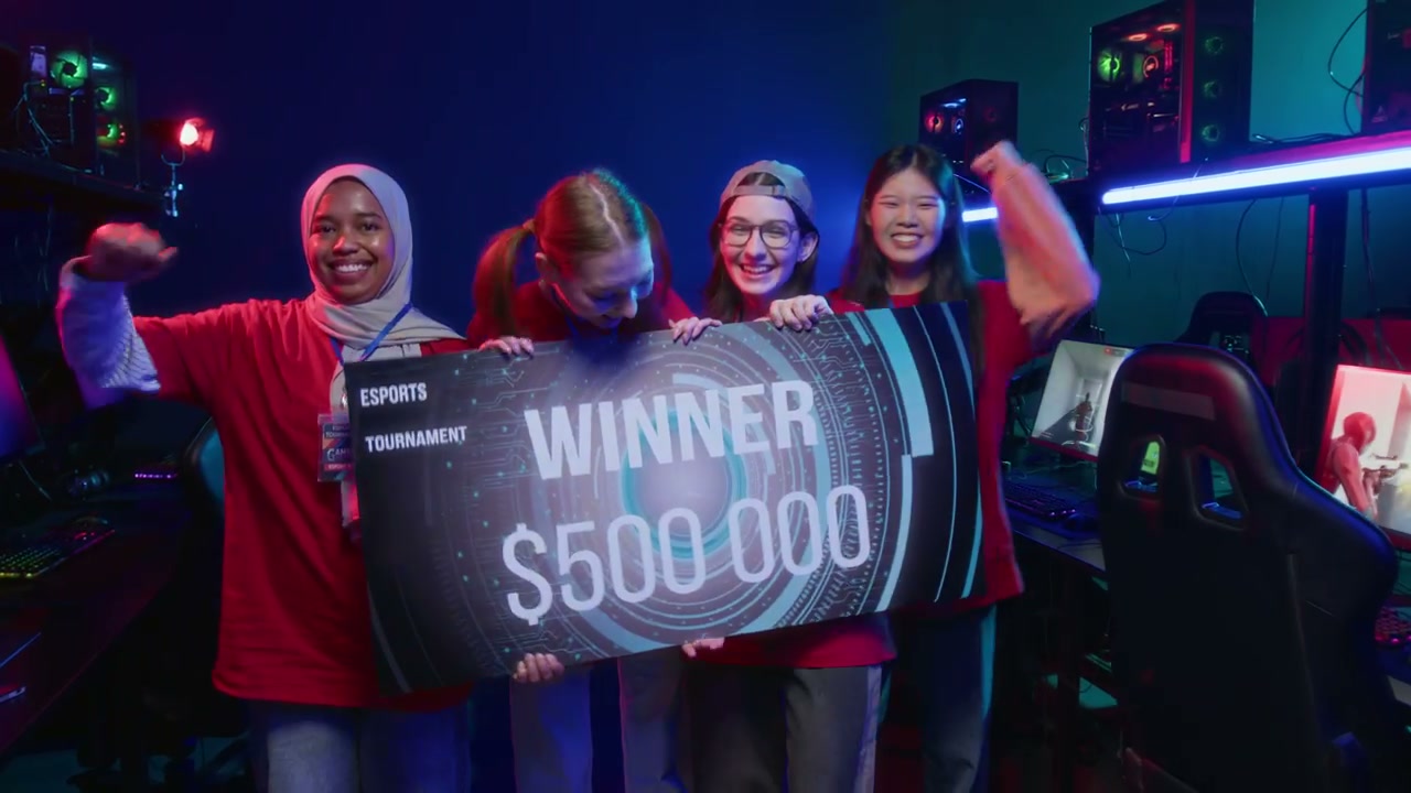 Diverse Female Cybersport Team Cheering at Winning Cash Prize