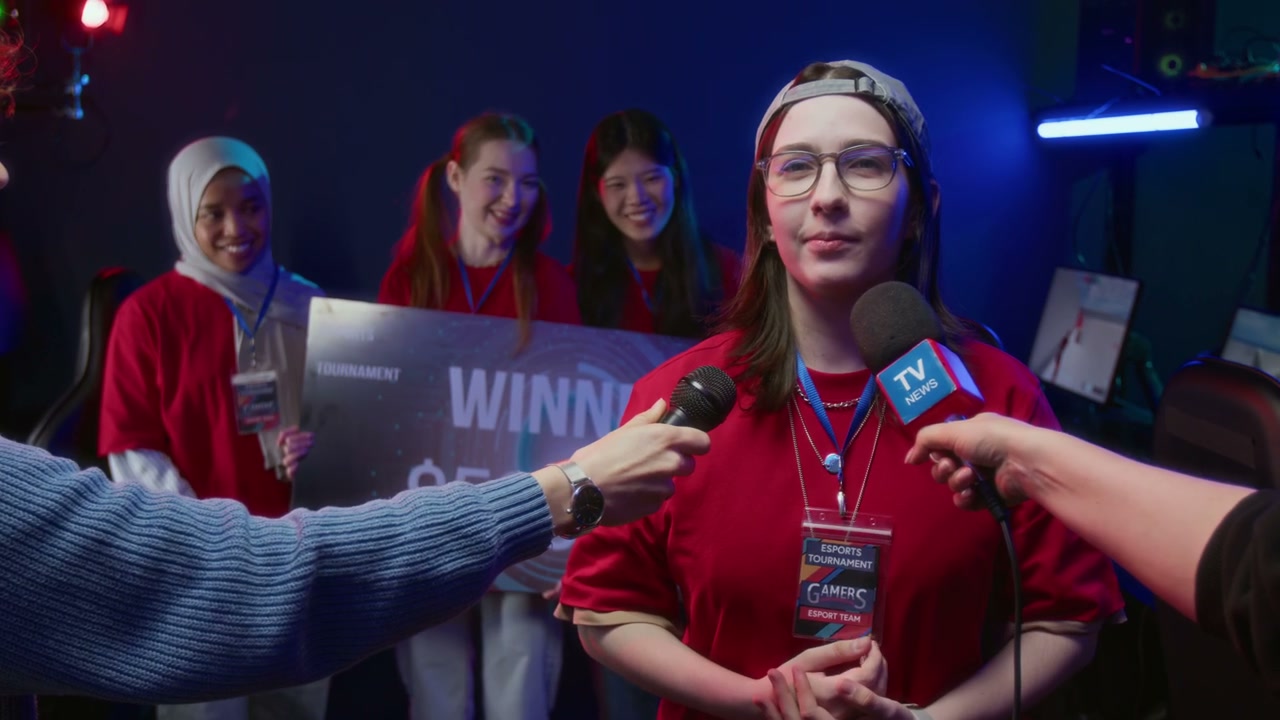 Ecstatic Young Female Gamer Speaking to Media after Team Victory