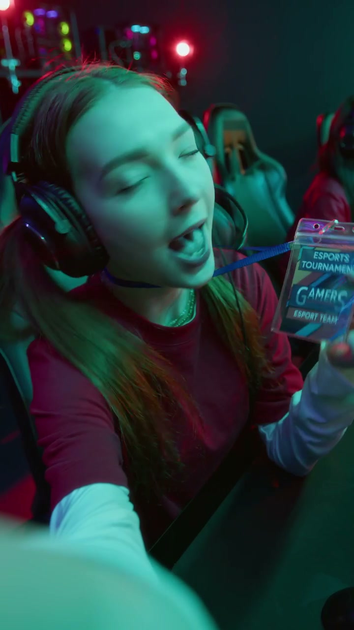 UGC of Happy Female Blogger Participating in Video Game Championship with Team