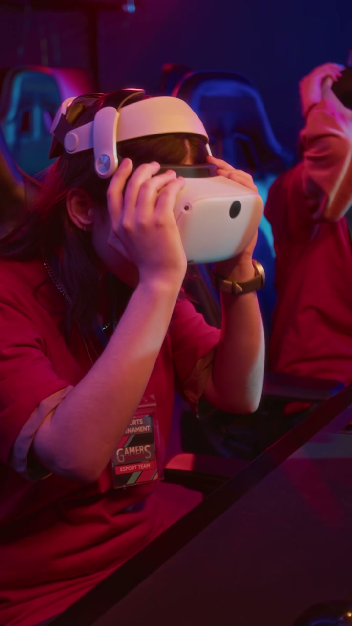Two Female Gamers Testing New Virtual Reality Headsets in Cyberclub