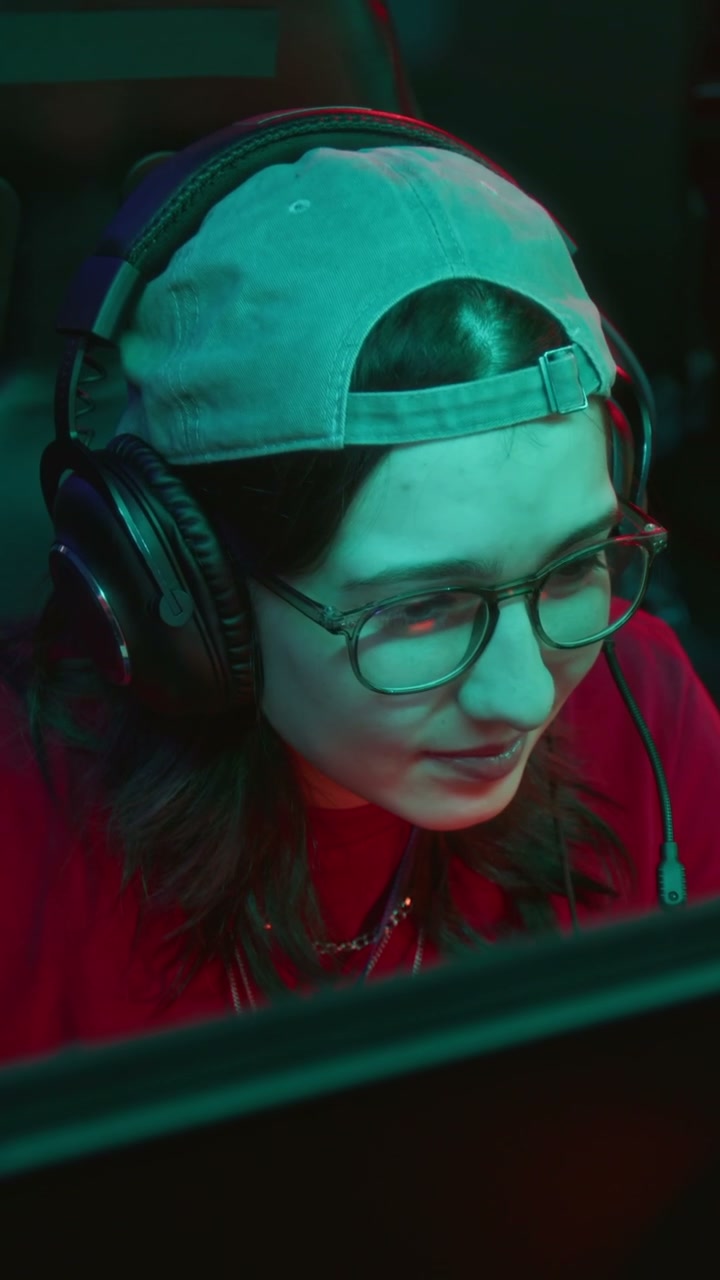 Female Gamer Smiling with Headset in Cyberclub