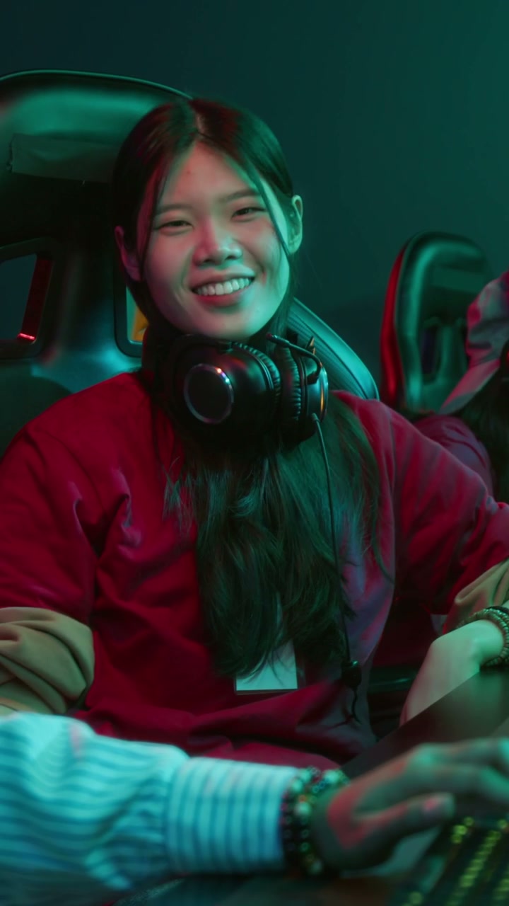 Smiling Female Gamer in Neon Cyberclub