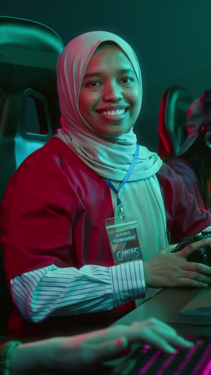 Smiling Female Gamer at Esports Tournament