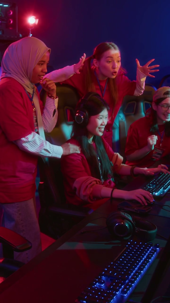 Women Gaming Team Cheering in Cyberclub