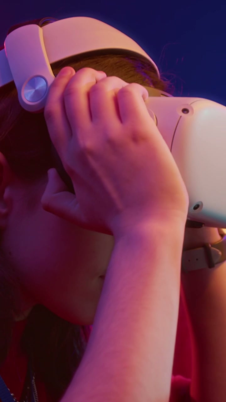Female Gamer Puts on VR Headset