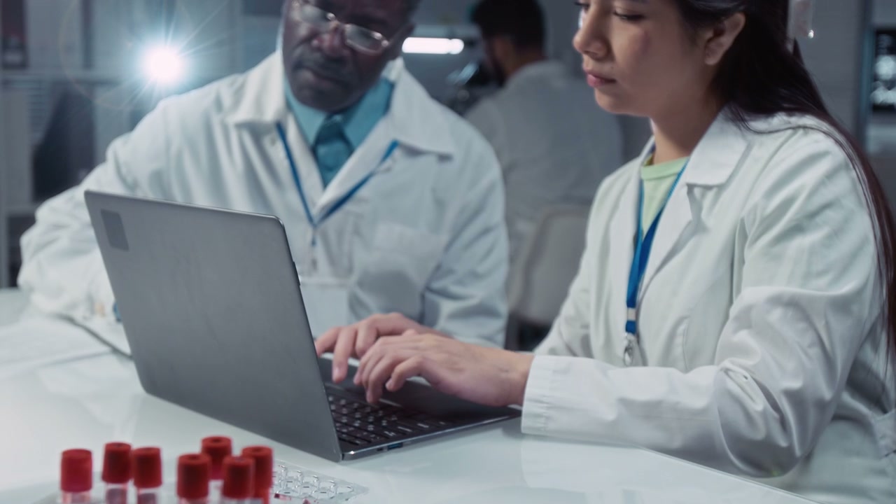 Scientists Discussing Research Data in Lab
