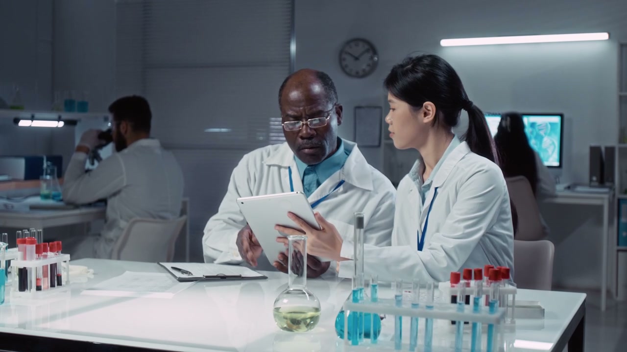 Diverse Scientists Discussing Research in Lab
