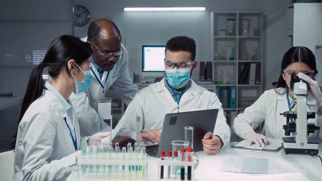 Multiethnic Scientists Collaborating in Lab