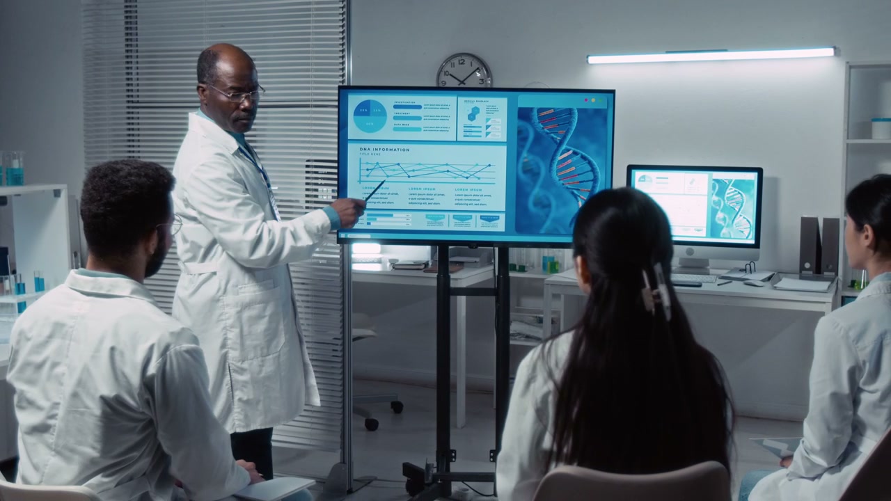 Scientist Explains DNA Research to Lab Group