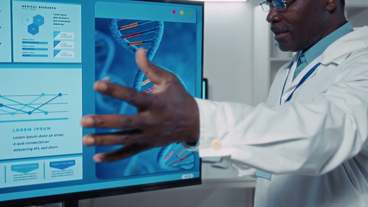 Male Scientist Explaining DNA Model on Screen