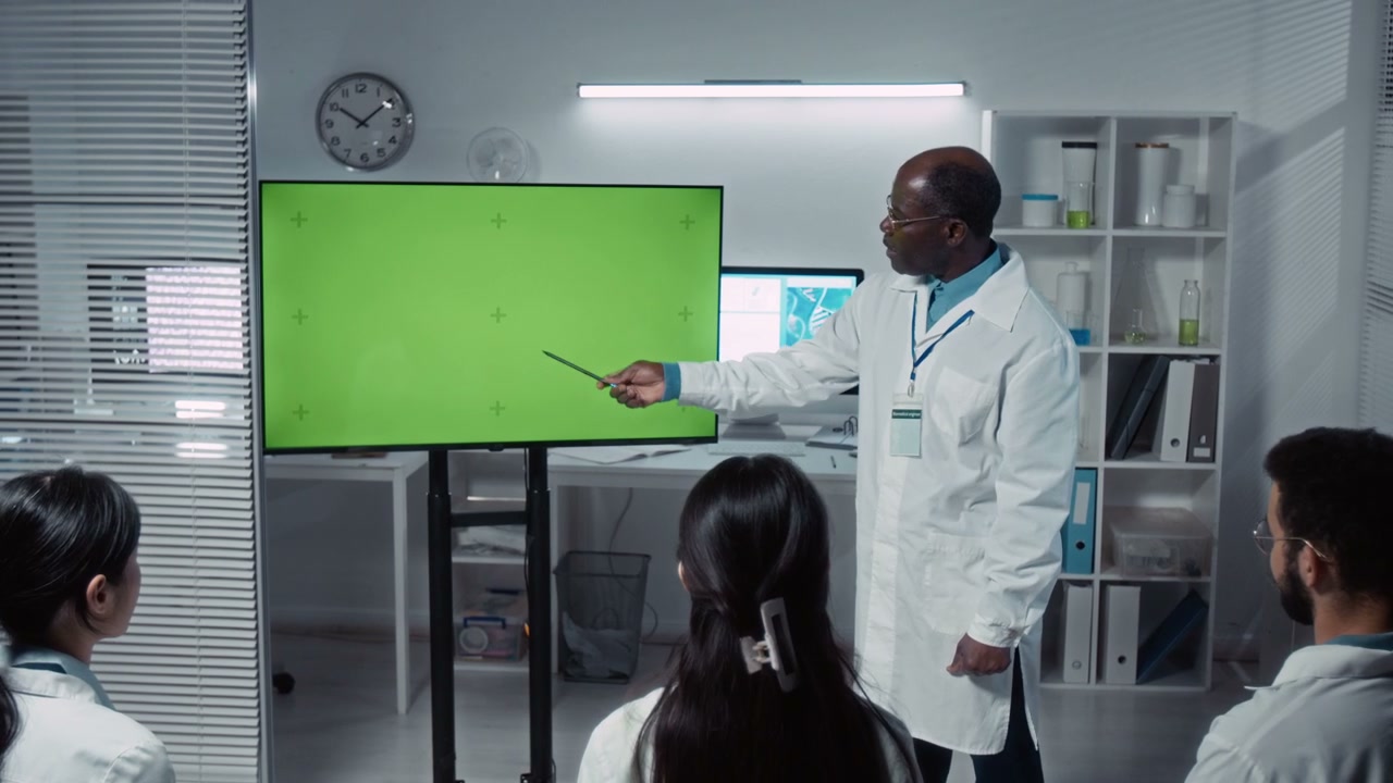Scientist Giving Green Screen Presentation to Students