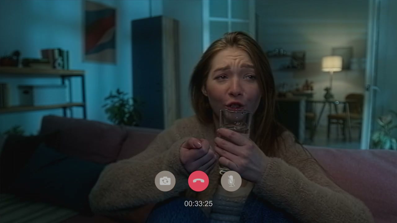 Scared Woman on Video Call at Night