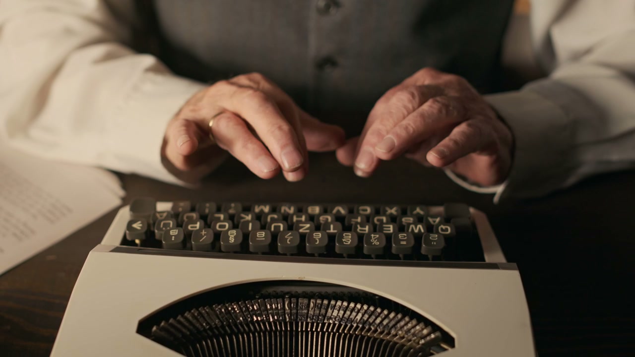 Hands Typing on Vintage Typewriter