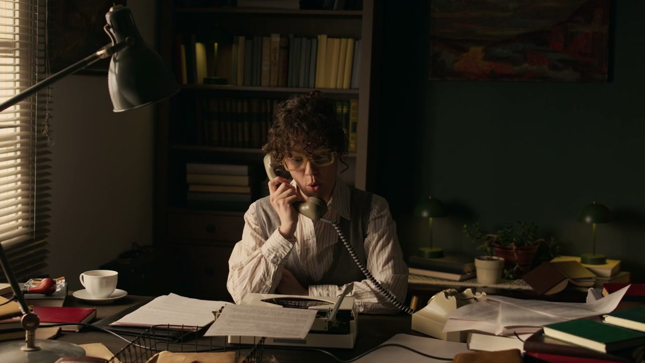Woman Answering a Retro Phone in a Vintage Office