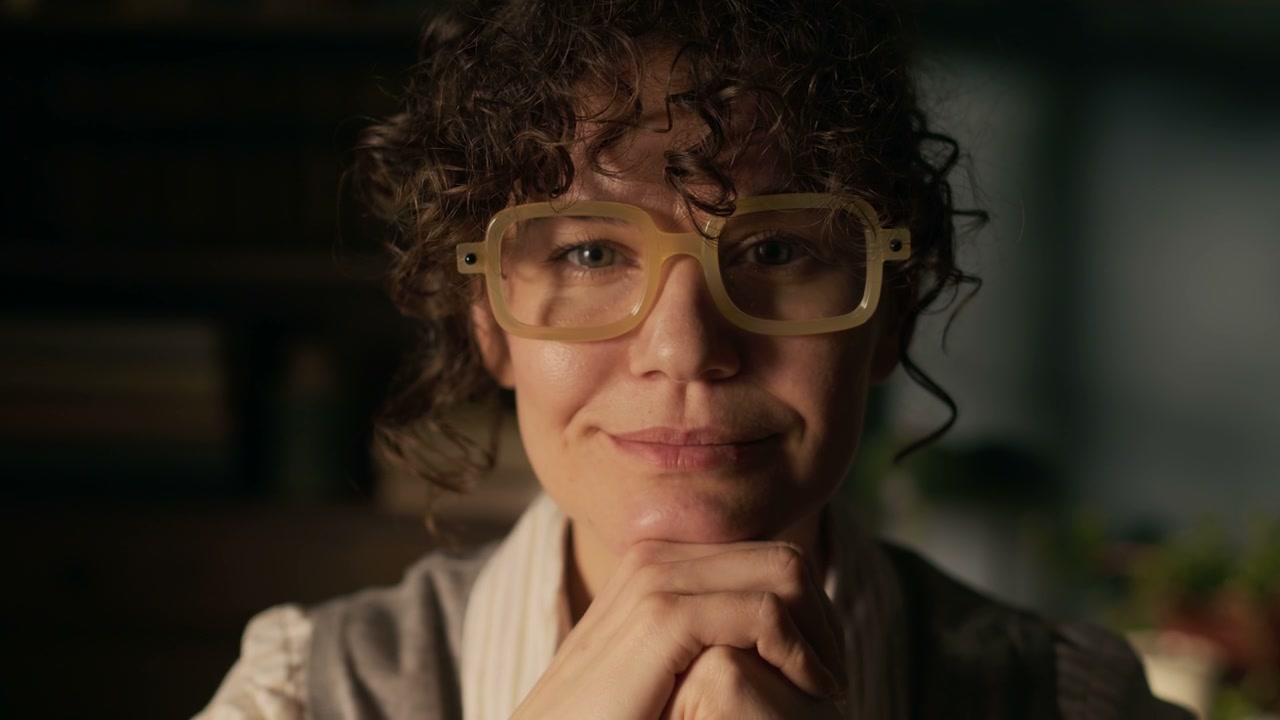 Thoughtful Woman in Retro Glasses
