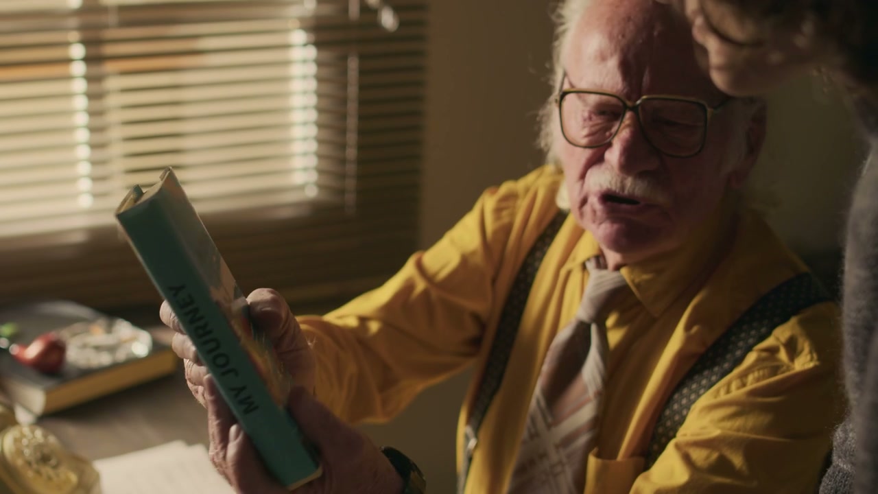 Vintage Writer Discussing 'My Journey' Book
