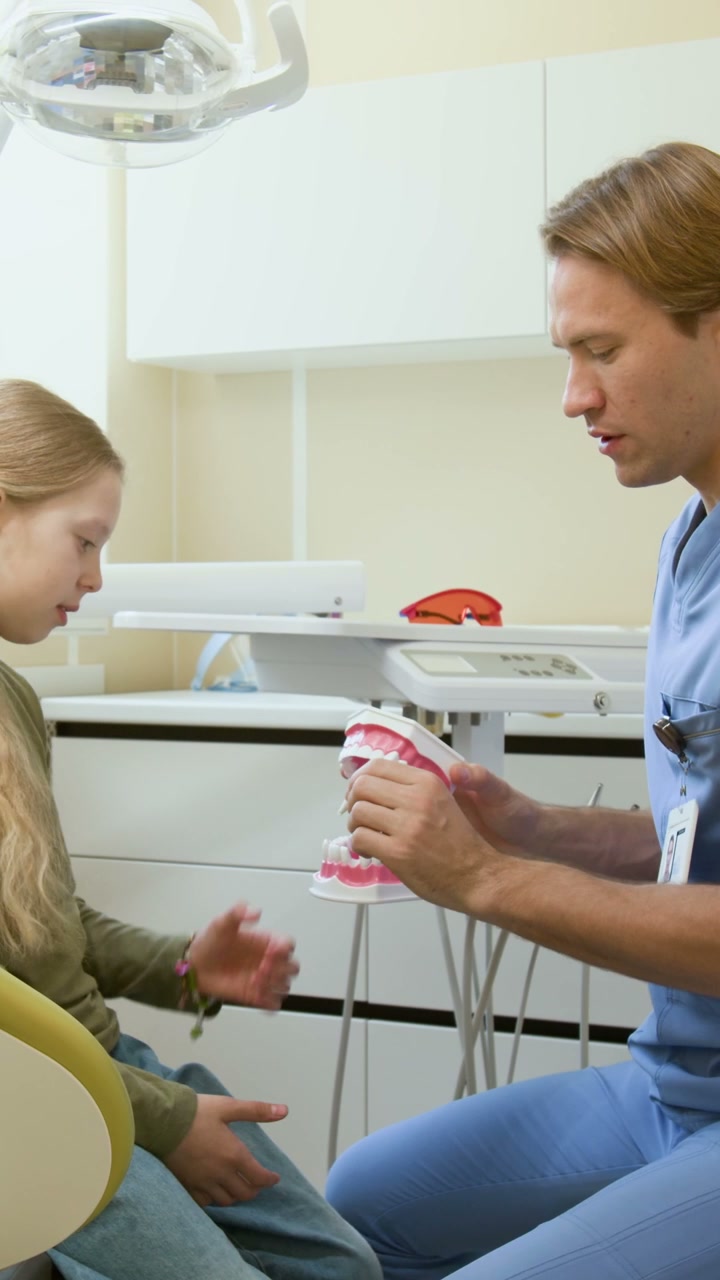 Dentist Teaches Girl About Losing Baby Teeth
