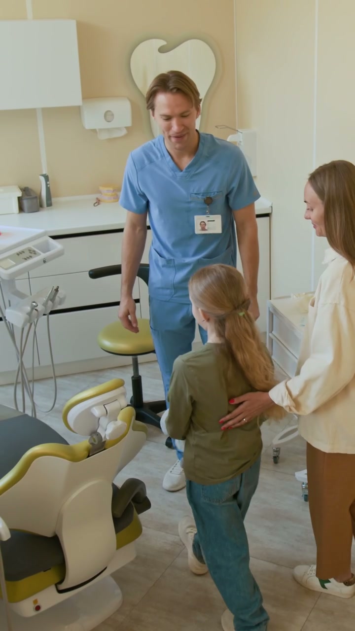 Dentist Welcomes Mother and Daughter Patient