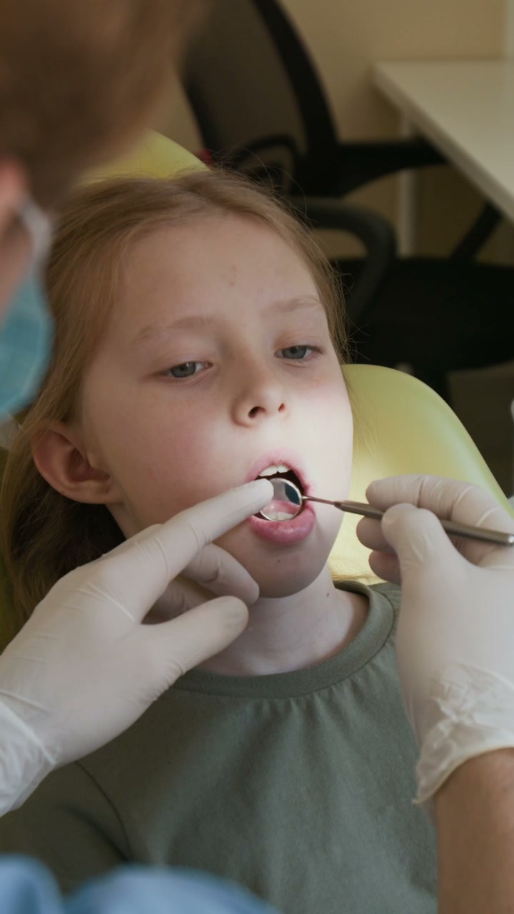 Girl Getting Dental Exam at Dentist's Office