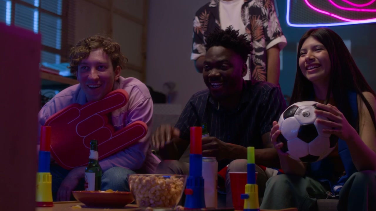 Young Friends Watching Sports on TV