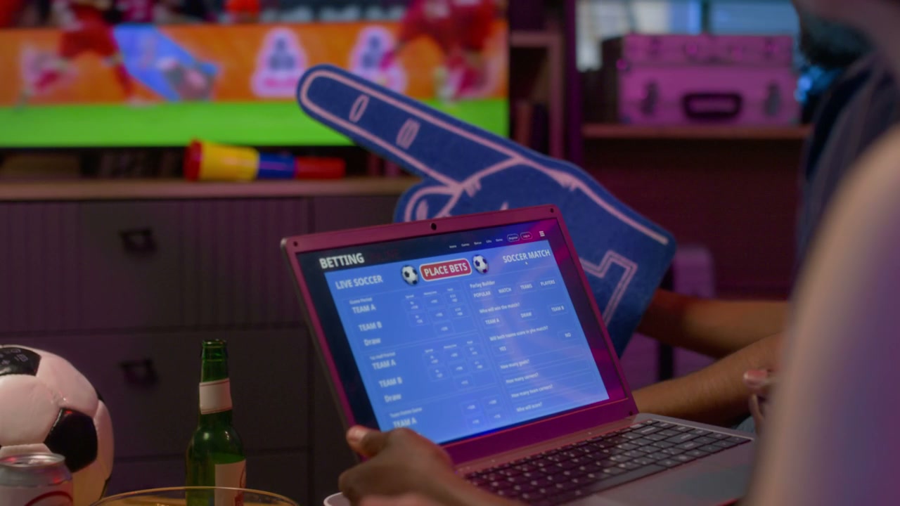 Friends Watching Football Match and Online Betting
