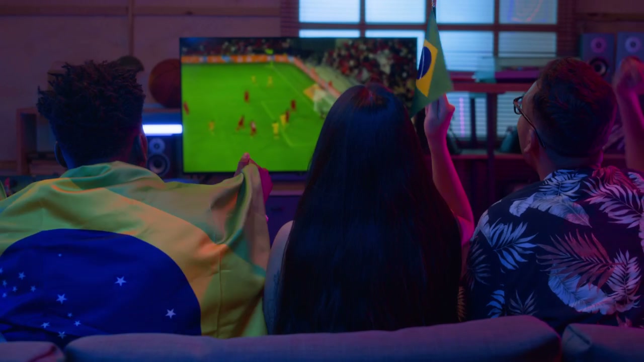 Brazilian Fans Watching Football Match at Home
