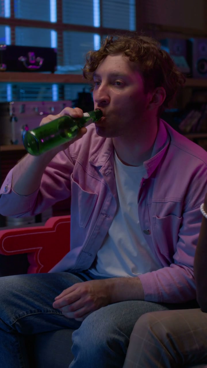 Man Drinking Beer and Watching Sports
