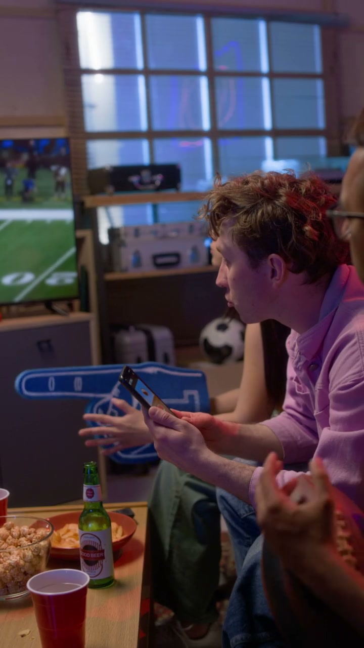 Excited Friends Watching Football and Betting