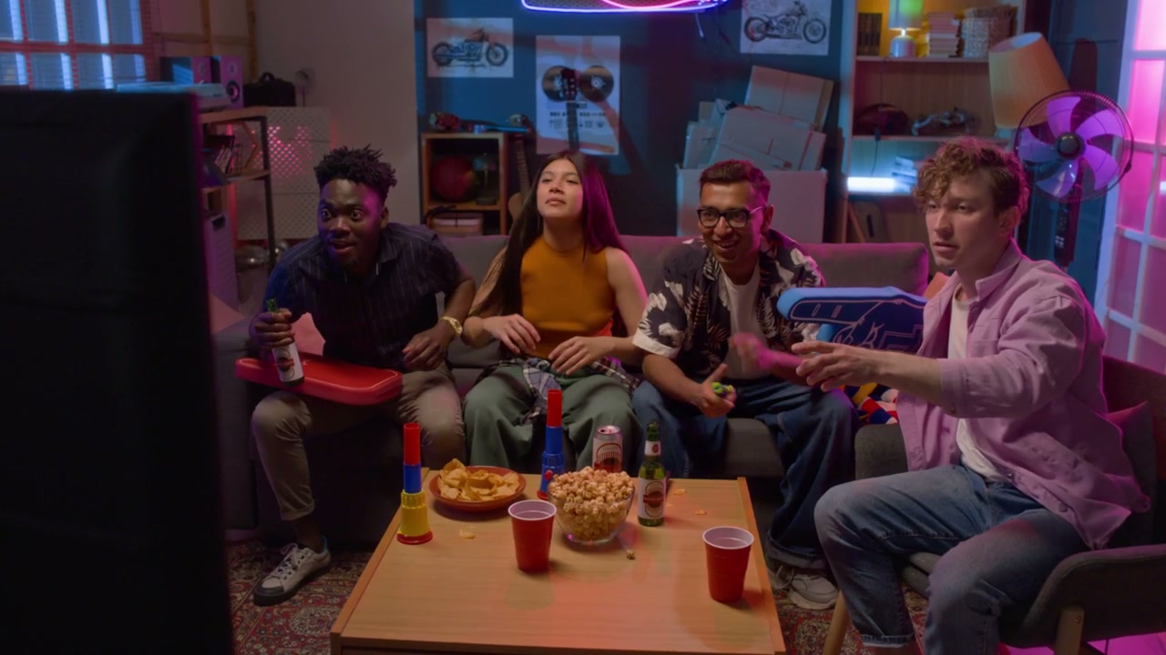 Group of Friends Watching Sports on TV at Home