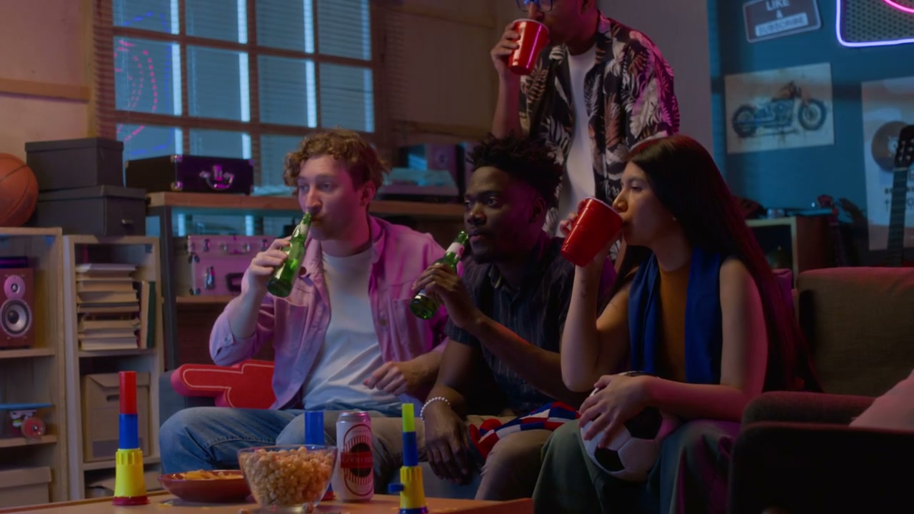 Friends Watching Sports Game at Home