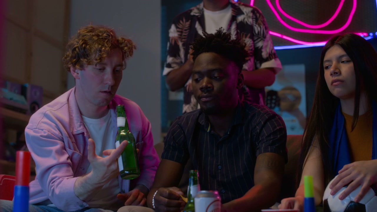 Multiethnic Friends Watching Sports at Night
