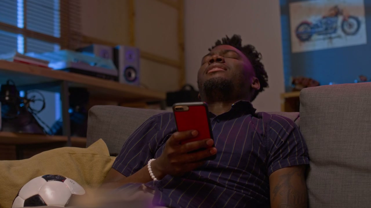 Man Reacting to Sports Loss on Phone