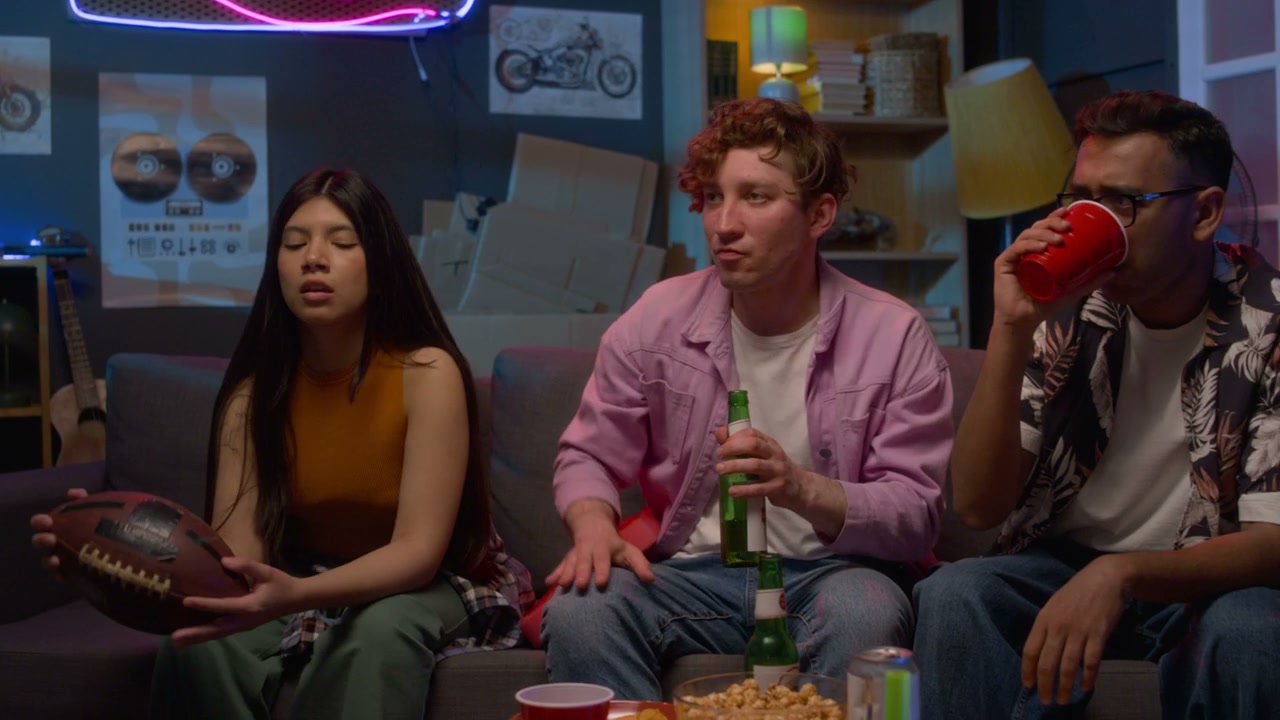 Friends Watching Sports and Drinking Beer