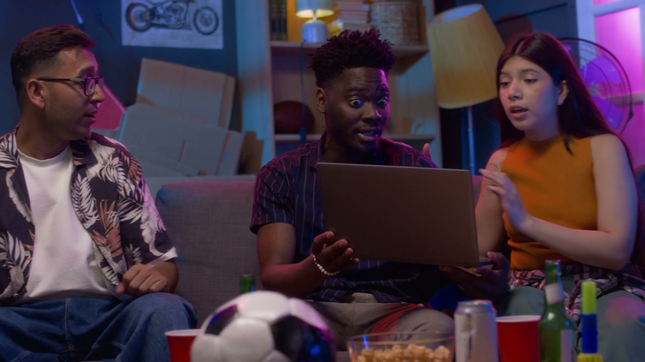 Friends Reacting to Online Sports Result