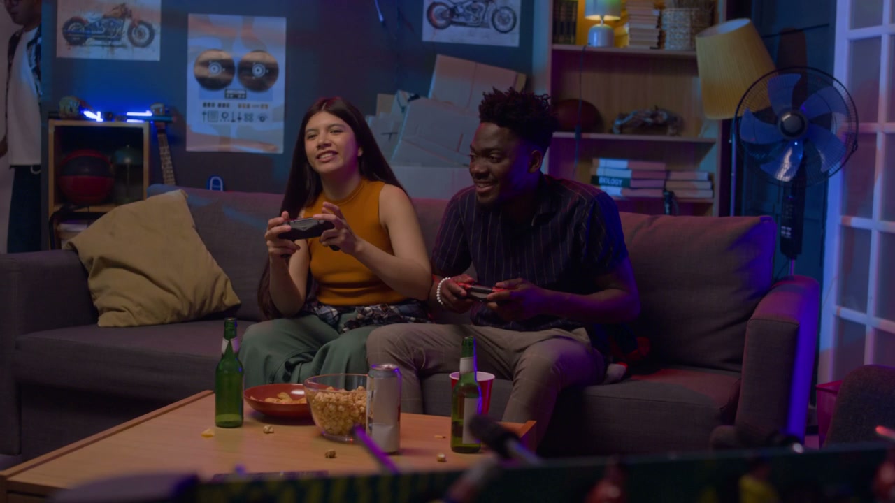Diverse Friends Playing Video Games at Home