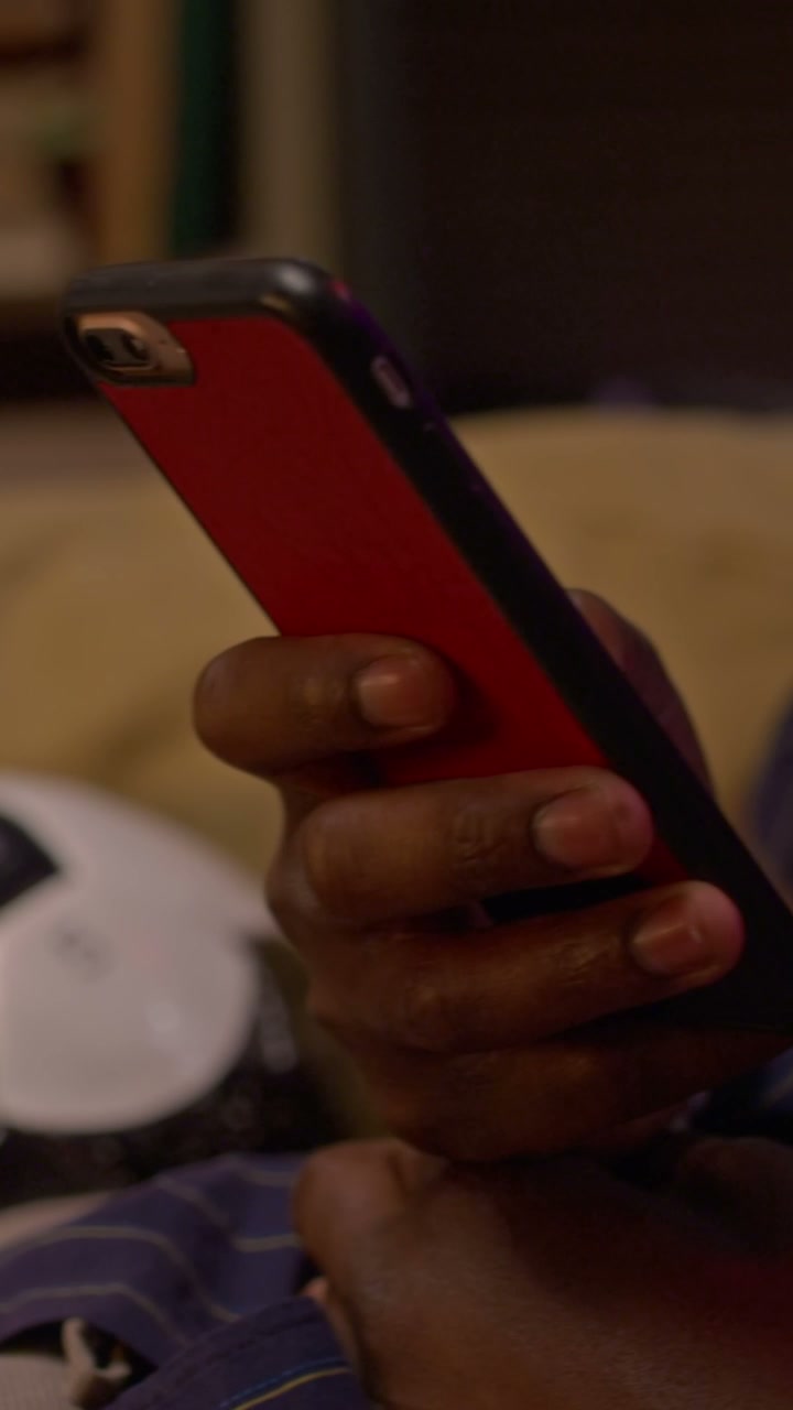 Man Watching Sports on Smartphone