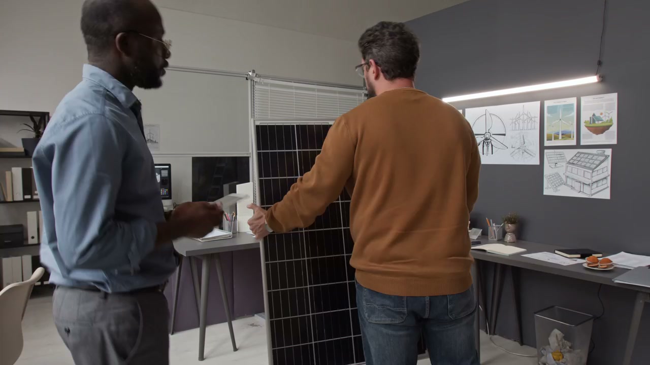 Renewable Energy Engineers Working with Solar Panels