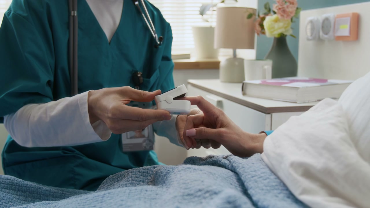 Healthcare Professional Using Pulse Oximeter