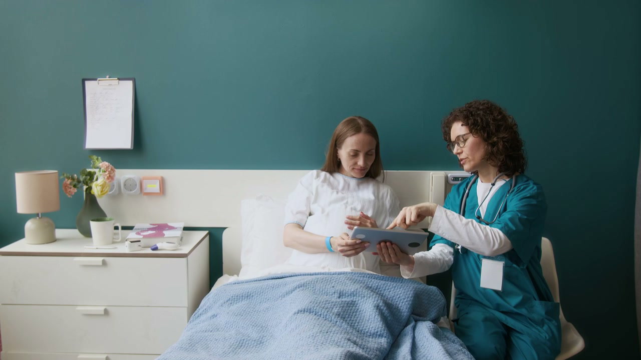 Maternity Consultation With Digital Tablet